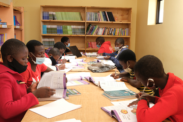 Image of Kuwala students studying with mask on for COVID-19.