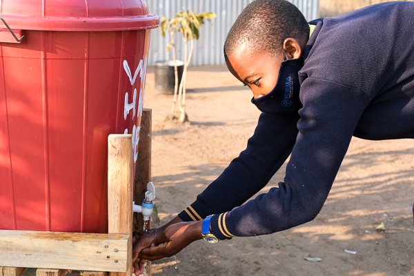 Image of Kuwala student washing hands