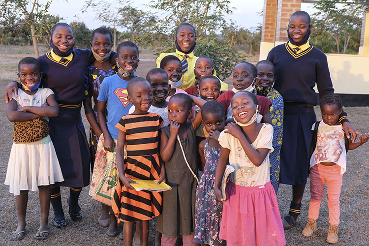 Kuwala students with village kids on their community outreach program.