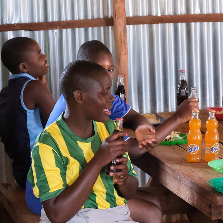 The Kuwala Girls enjoying a soda after Sports Day.