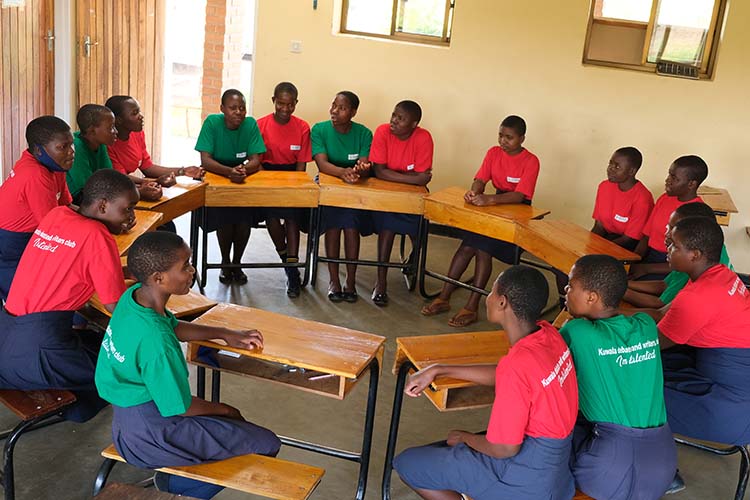 The debating club gathering in a circle seating down.