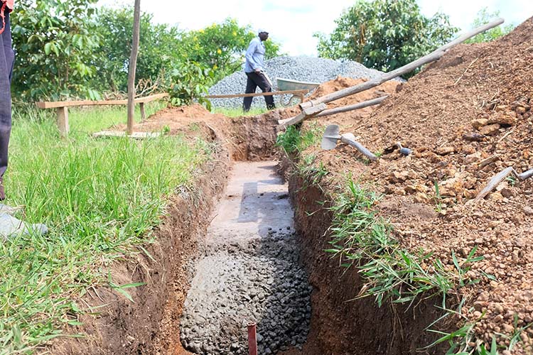 Workers working on the footings for the foundation