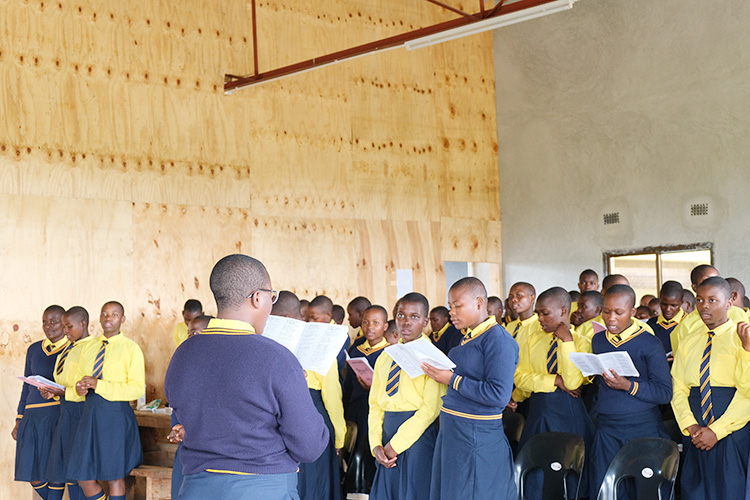 Kuwala students inside St. Peter's Assembly Hall on Sunday singing a hymn. 
