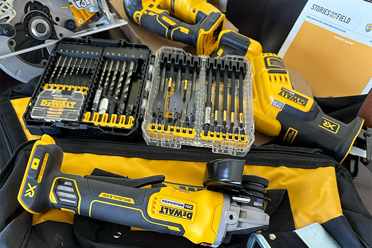 A bunch of Dewalt tools and a copy of the Stories from the Field Kuwala magazine in the background.