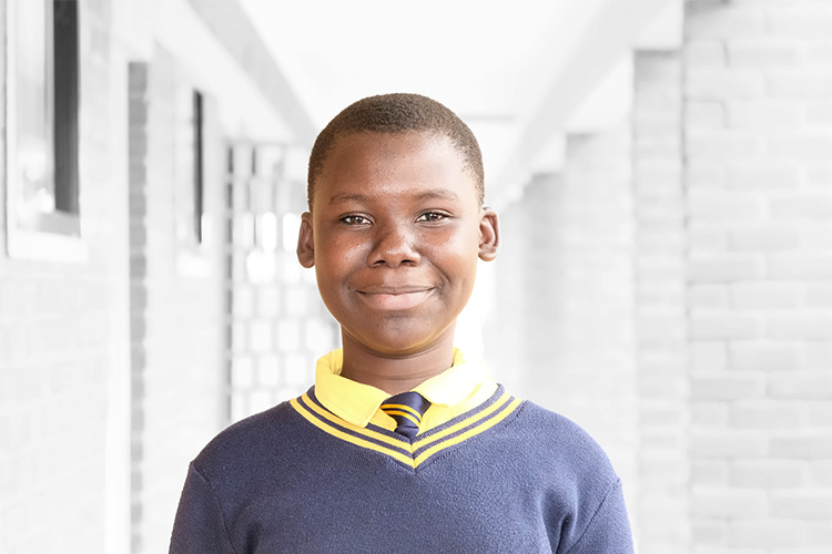 Naomi outside classroom block.