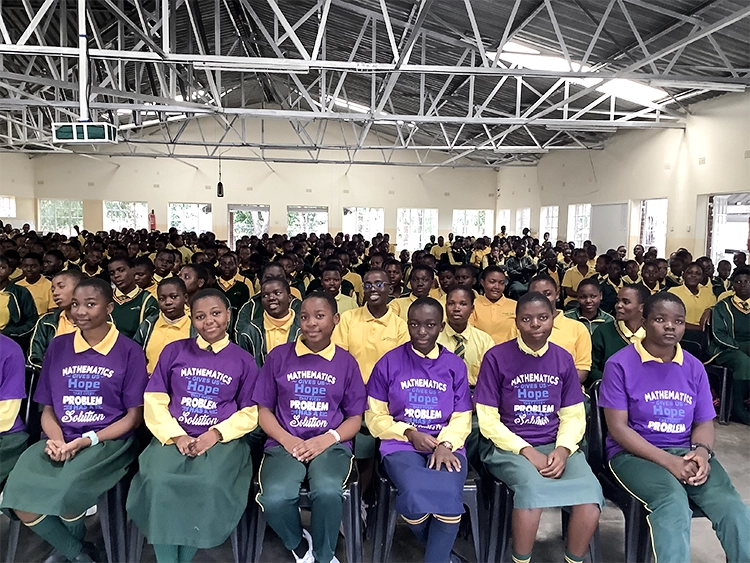 Mathematics Olympiad finalists in the front row with the Kuwala student body in behind them all seated in St. Peter's Assembly Hall.